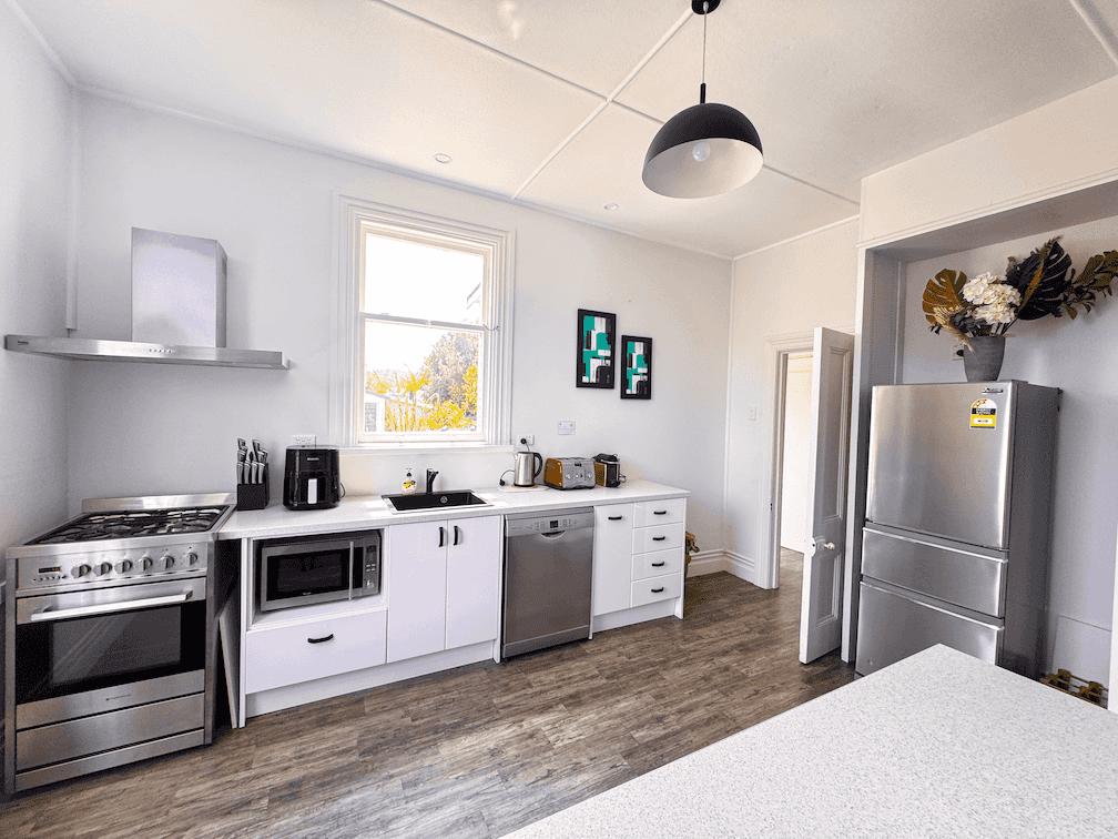 Kitchen area at 4-bedroom holiday house in Gisborne, fully equipped and operated by Accommodation in Gisborne.