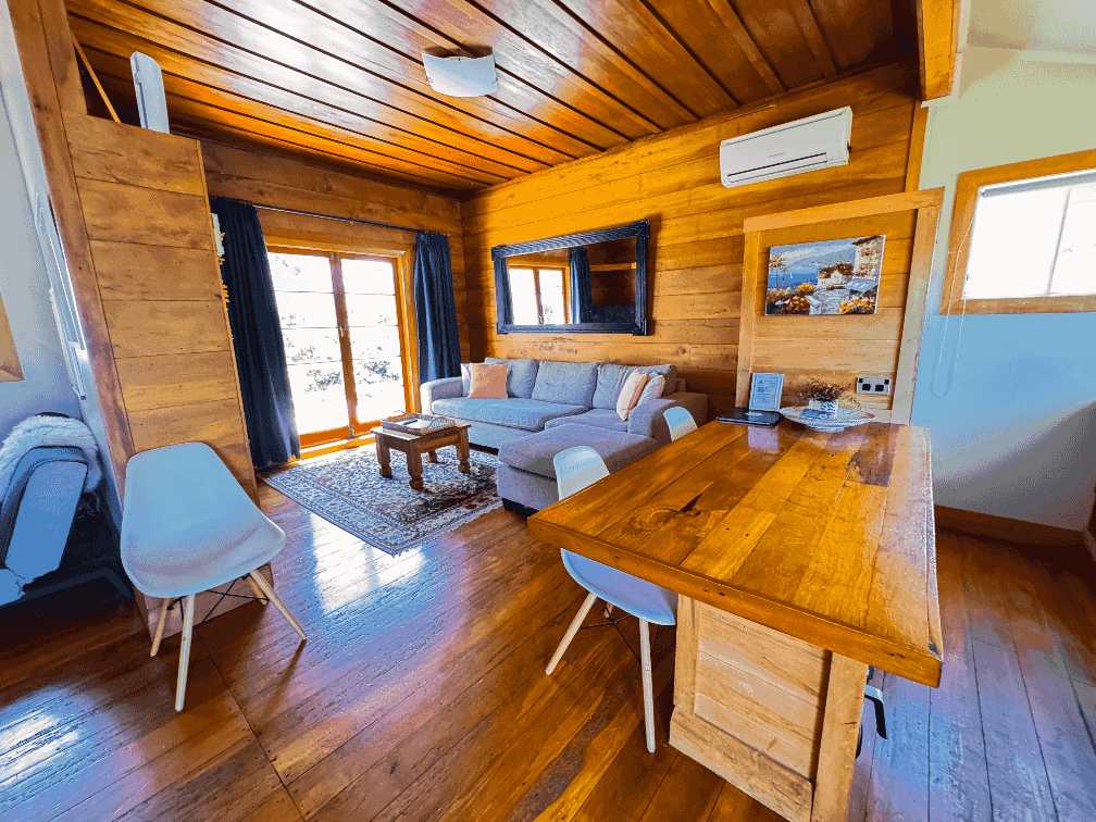 Harris Hideaway, a 2-bedroom cottage in Gisborne photo features the kitchen and view of the lounge