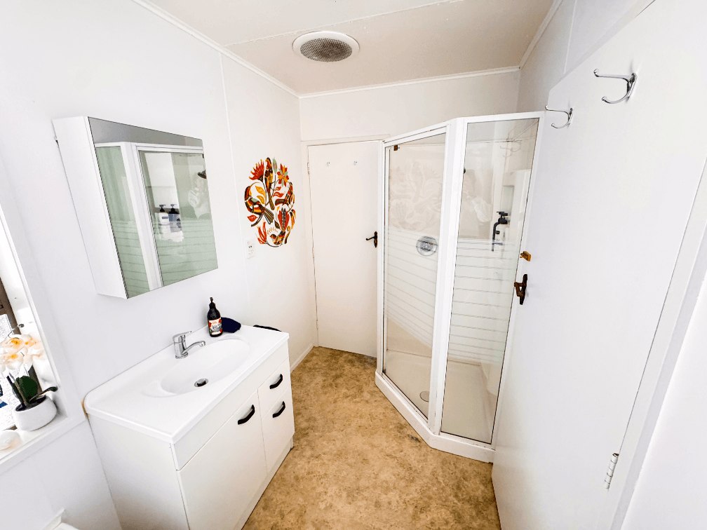 Bathroom featuring shower and vanity in the 3-bedroom plus rumpus (total 4 bedrooms) Russell Rumpus Retreat holiday house, Gisborne, operated by Accommodation in Gisborne.