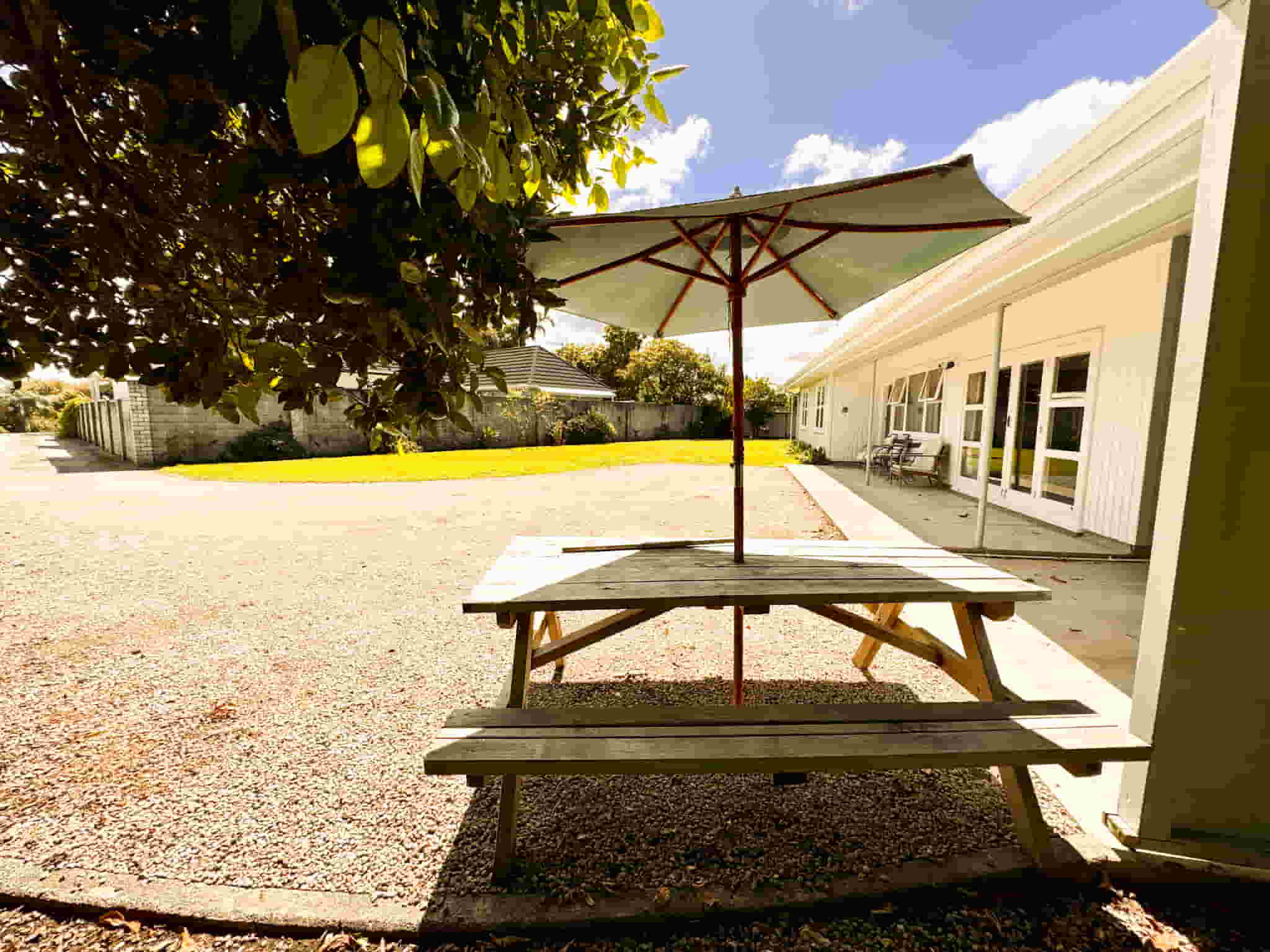 Outdoor area at Esplanade Easy Escape, 3 bedroom accommodation in Gisborne —photo of exterior picnic table and seating area