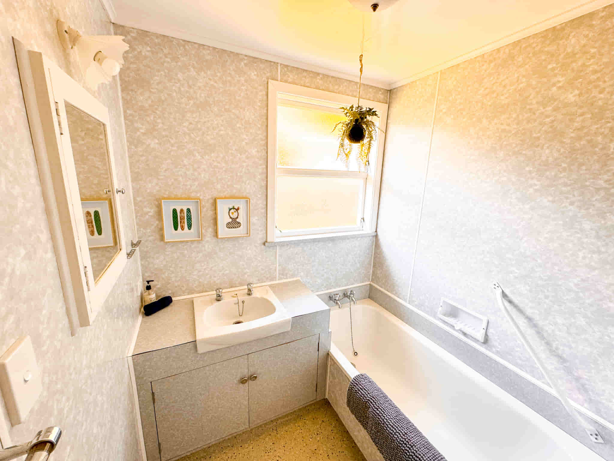 Accommodation in Gisborne Esplanade Easy Escape 3 bedroom house, photo is of bathroom, which has a bath and vanity