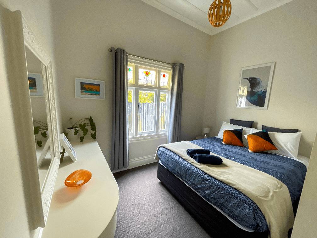 Accommodation in Gisborne Stafford Stays 3 bedroom house, photo is of middle/end room, showing queen 