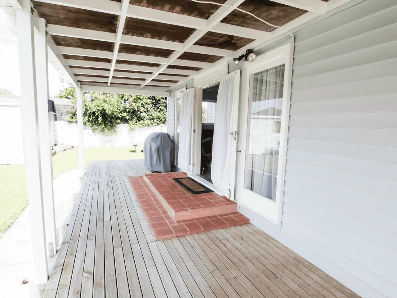 Outdoor deck at Stafford Stays showing French doors and BBQ, 3 bedroom accommodation in Gisborne —photo of exterior