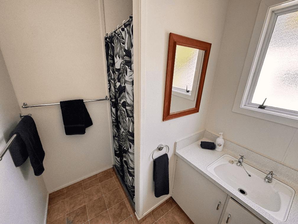 Shows shower and vanity, located in 3 bedroom at Aberdeen Villa