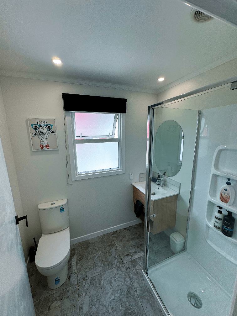 Shows updated bathroom at Unit 2, 325 Childers road at The Ascot Flat 2