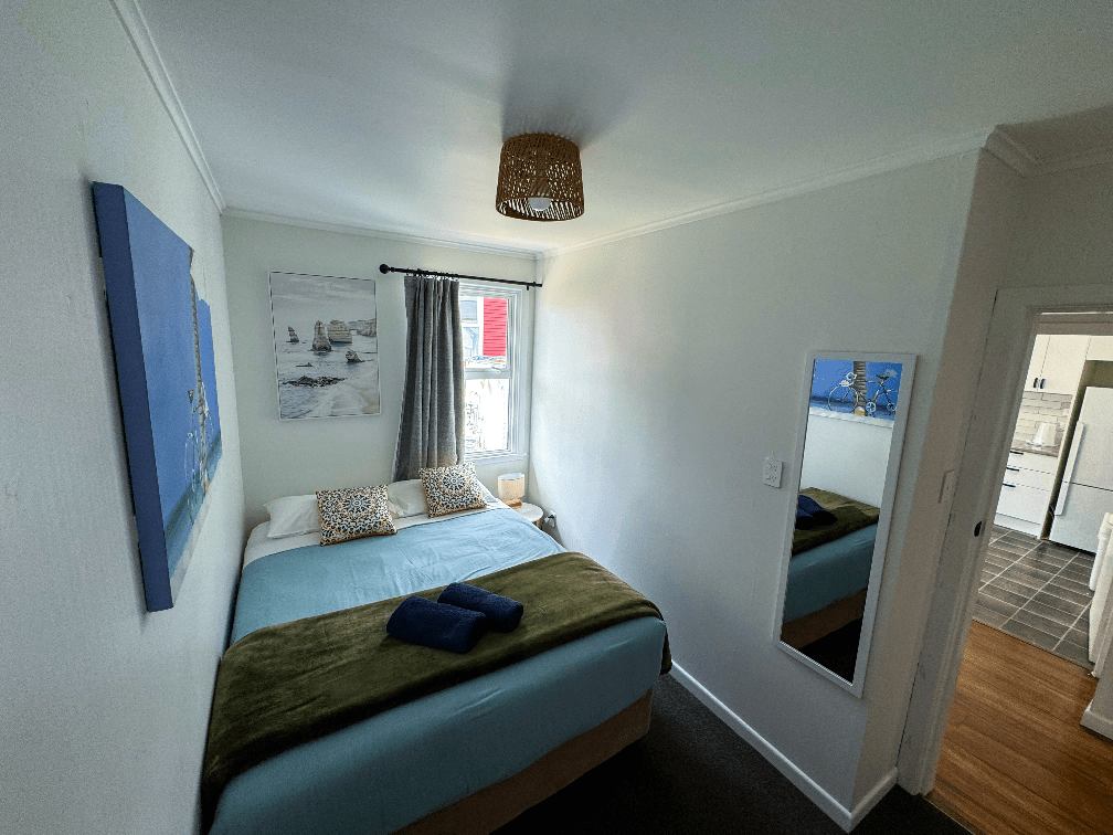 Accommodation in Gisborne The Ascot Flat 2 two bedroom flat, photo is of second smaller room, showing queen bed