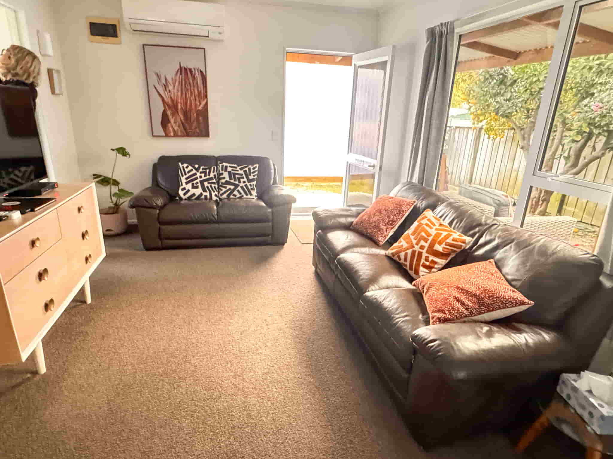 Accommodation in Gisborne Railway Nook 1 bedroom house, photo is of kitchen which shows the bath & Vanity.