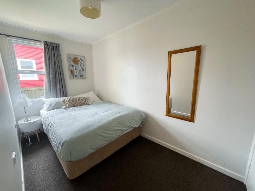 Accommodation in Gisborne The Ascot Flat 3 two bedroom flat, photo is of second smaller room, showing queen bed