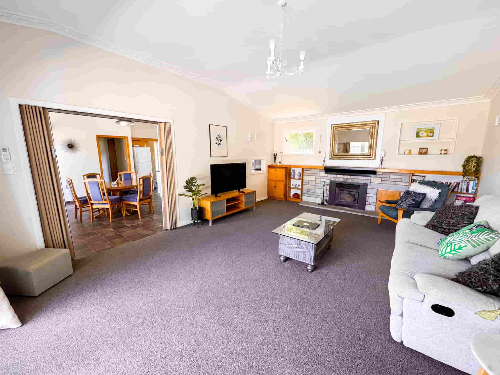Esplanade Easy Escape a 3-bedroom home in Gisborne photo features the large kitchen and view of the dining area
