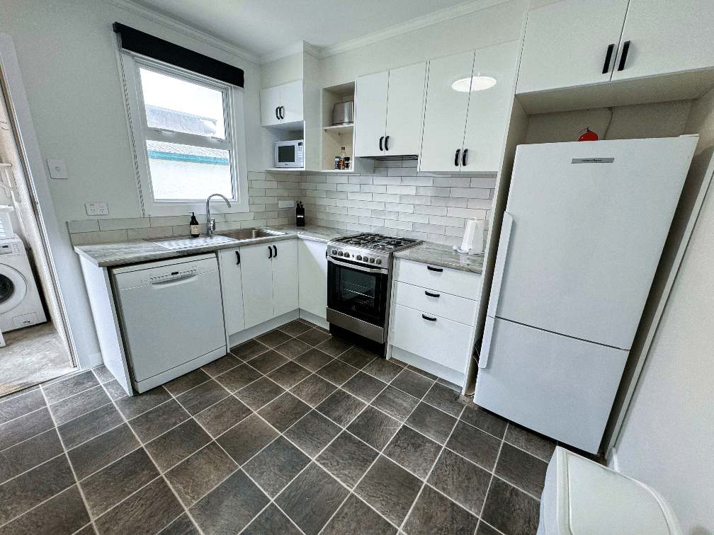 Front exterior of The Ascot Apartments at 325 Childers Road in Gisborne, a collection of four renovated 2-bedroom units ideal for families and groups.