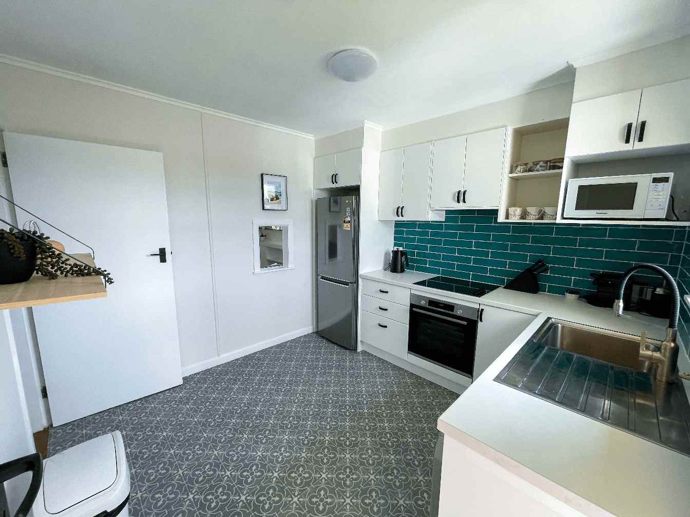 Ascot Apartments flat 4 325 photo of kitchen, grey floors, blue tiles, fresh modern look