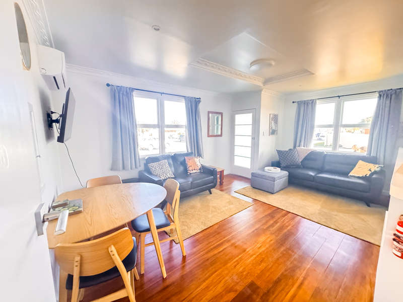 Flat 1 Lounge room of the Ascot Apartments at 325 Childers Road in Gisborne, a collection of four renovated 2-bedroom units ideal for families and groups.