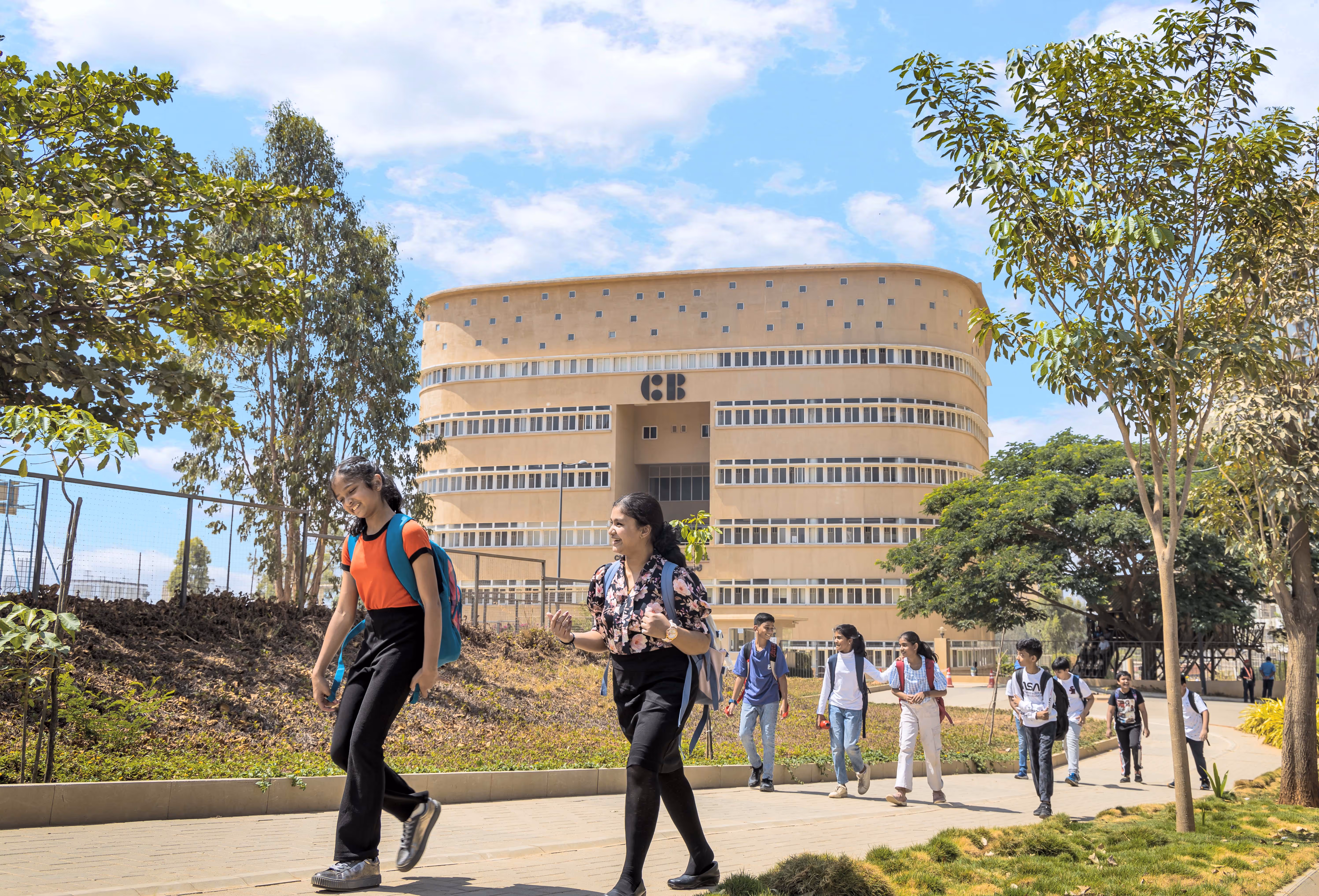 2 students walking out of campus