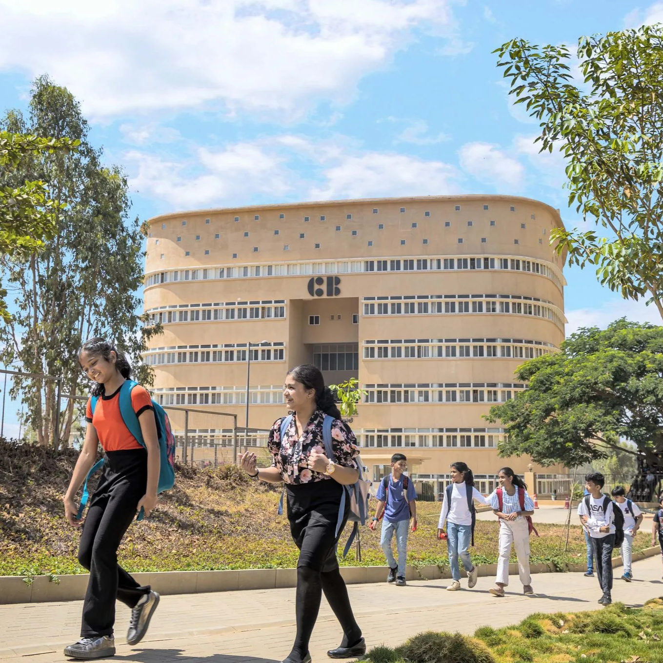 2 students walking out of campus