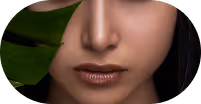 Close-up of a woman's face showing nose, lips with glossy lipstick, and part of a green leaf on the left side.