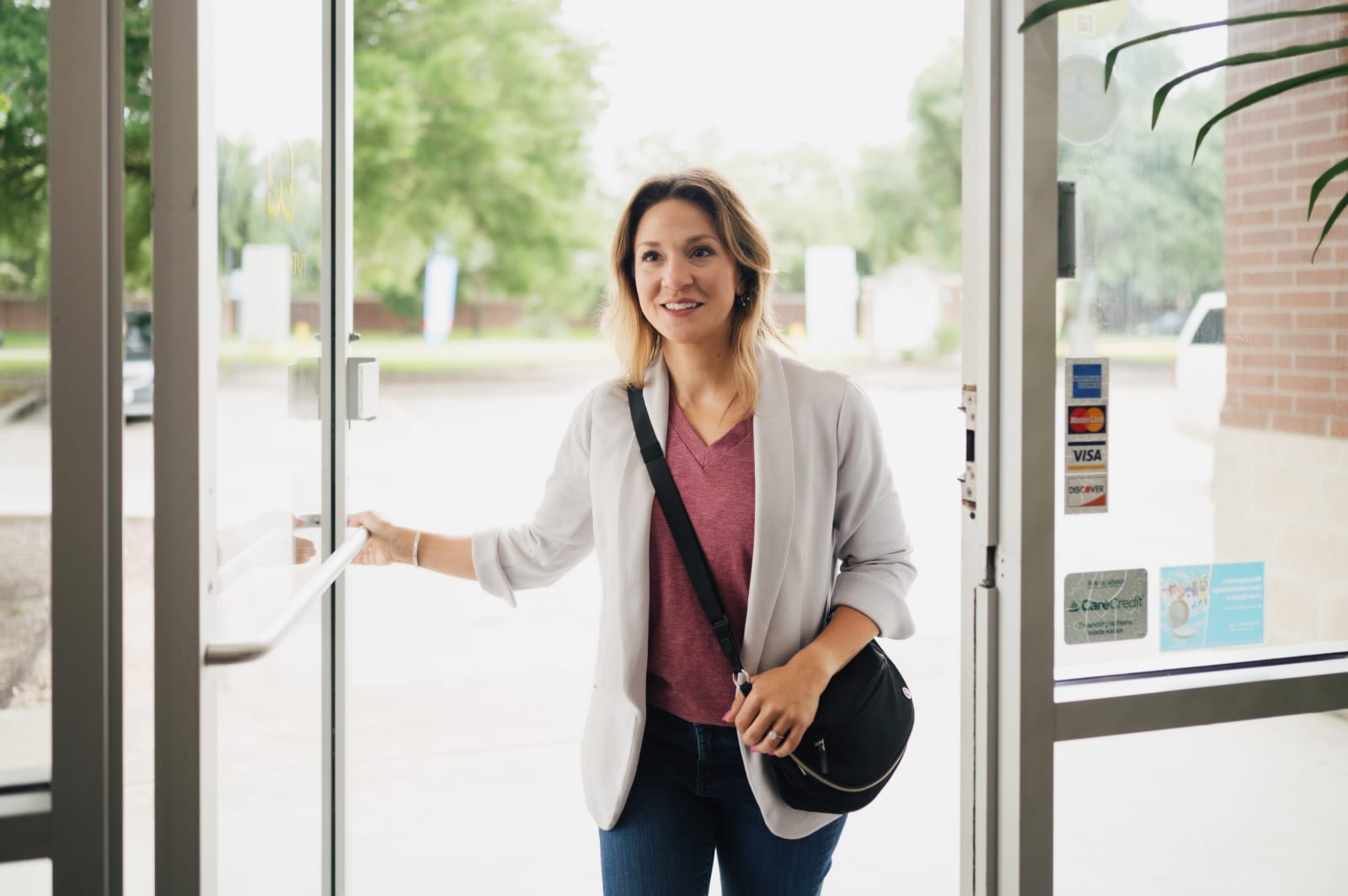 Patient walking into TÜTH Dental for invisalign treatment
