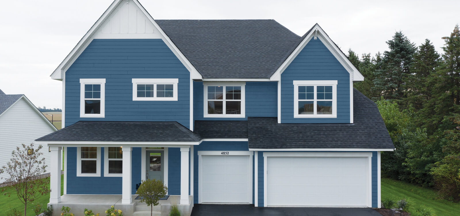 home with rapids blue house siding