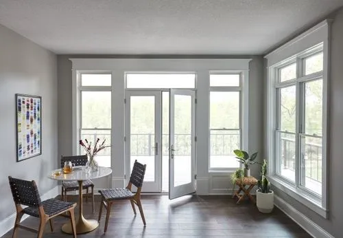 white french patio doors open to sunroom