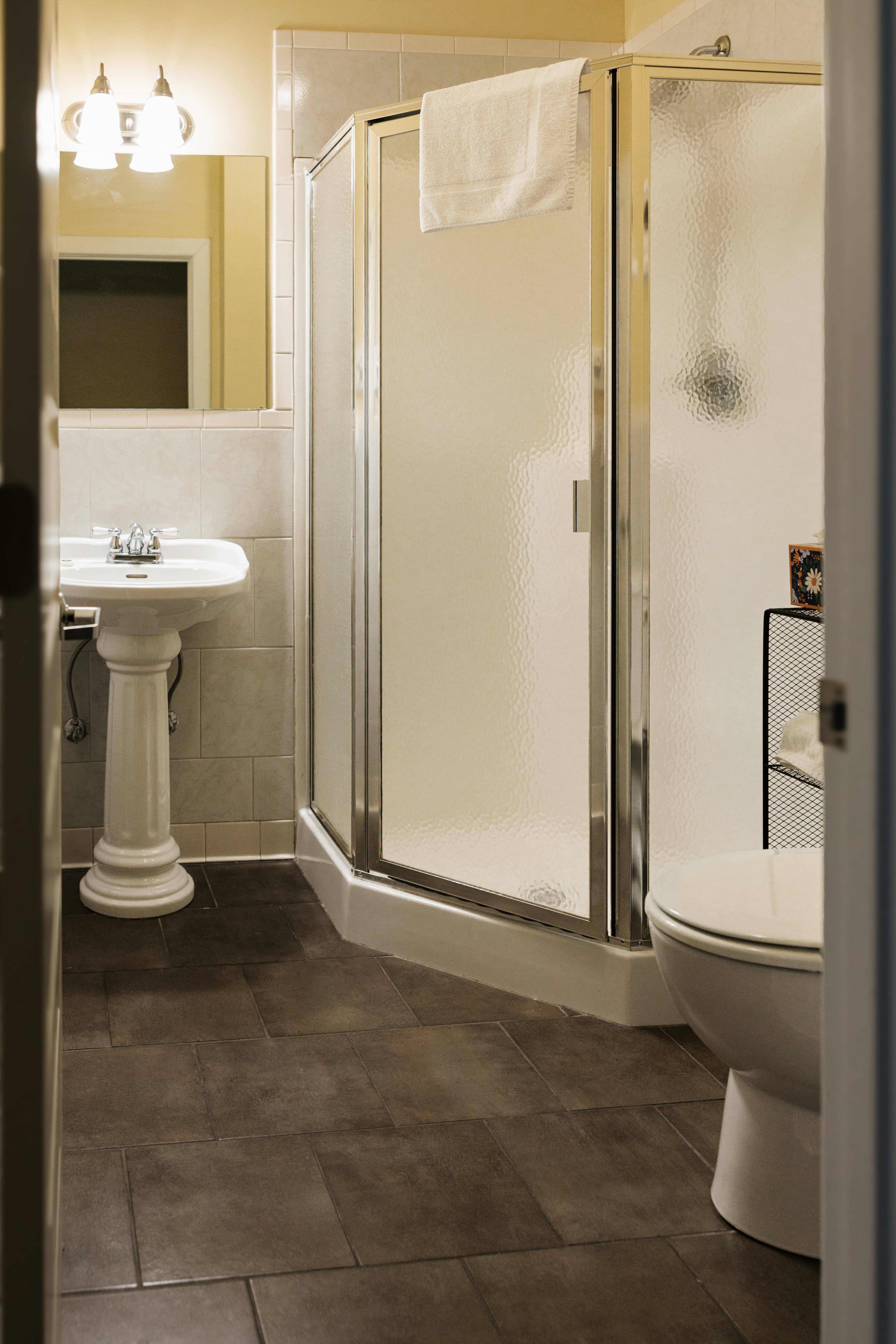 Bathroom shower and toilet in The Carlyle Room
