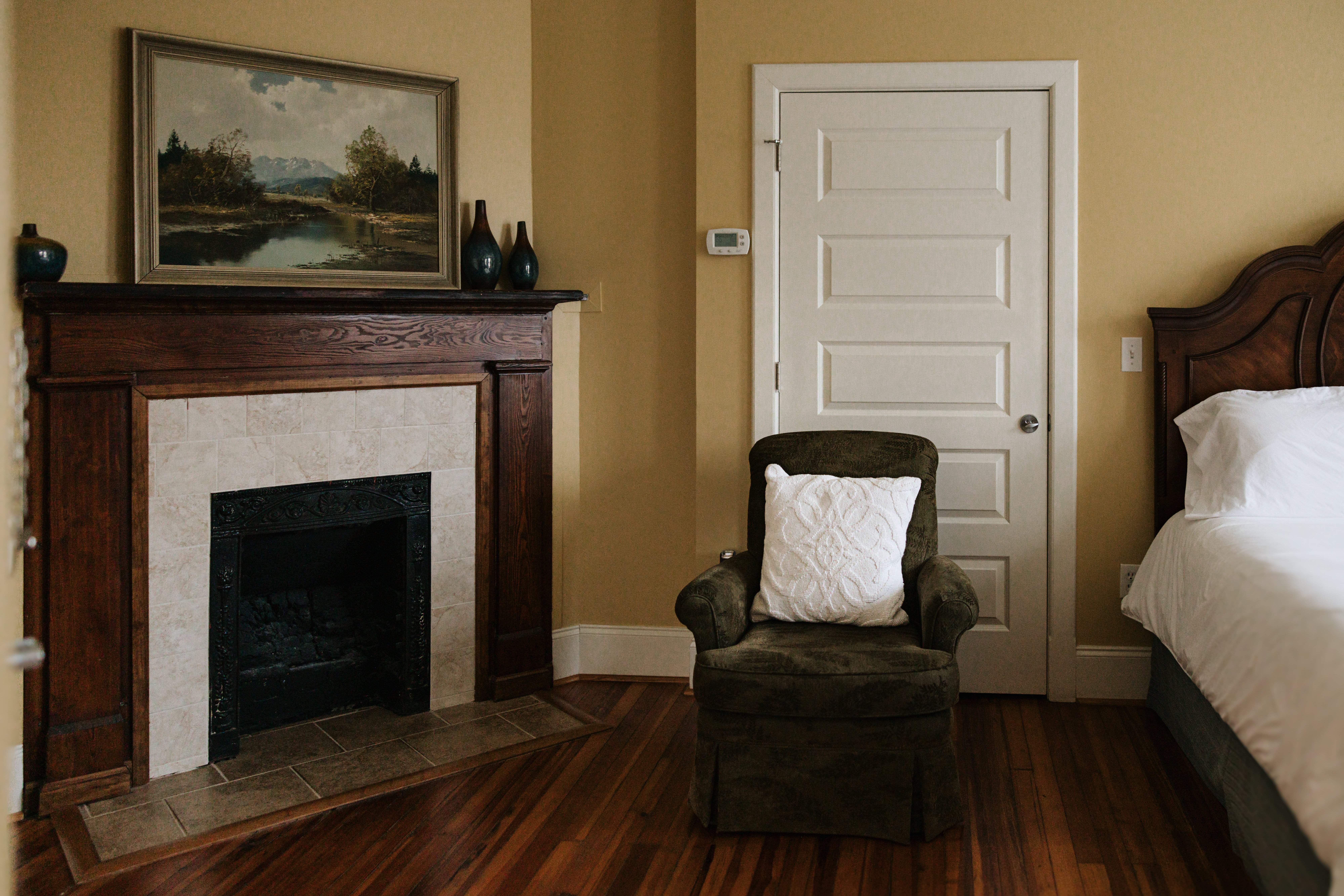 Fireplace and armchair in The Hunt Room