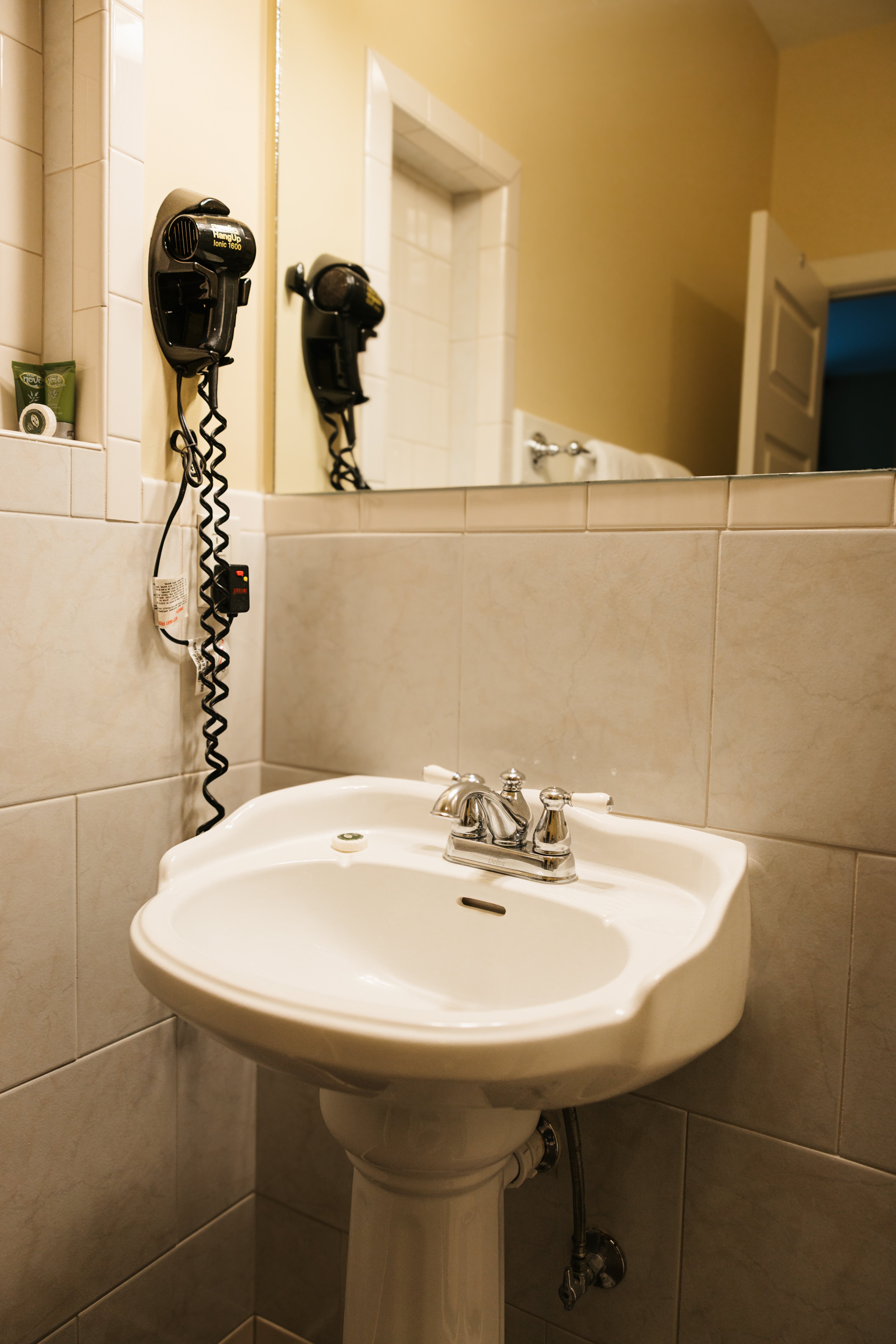 Bathroom vanity and sink in The Carlyle Room