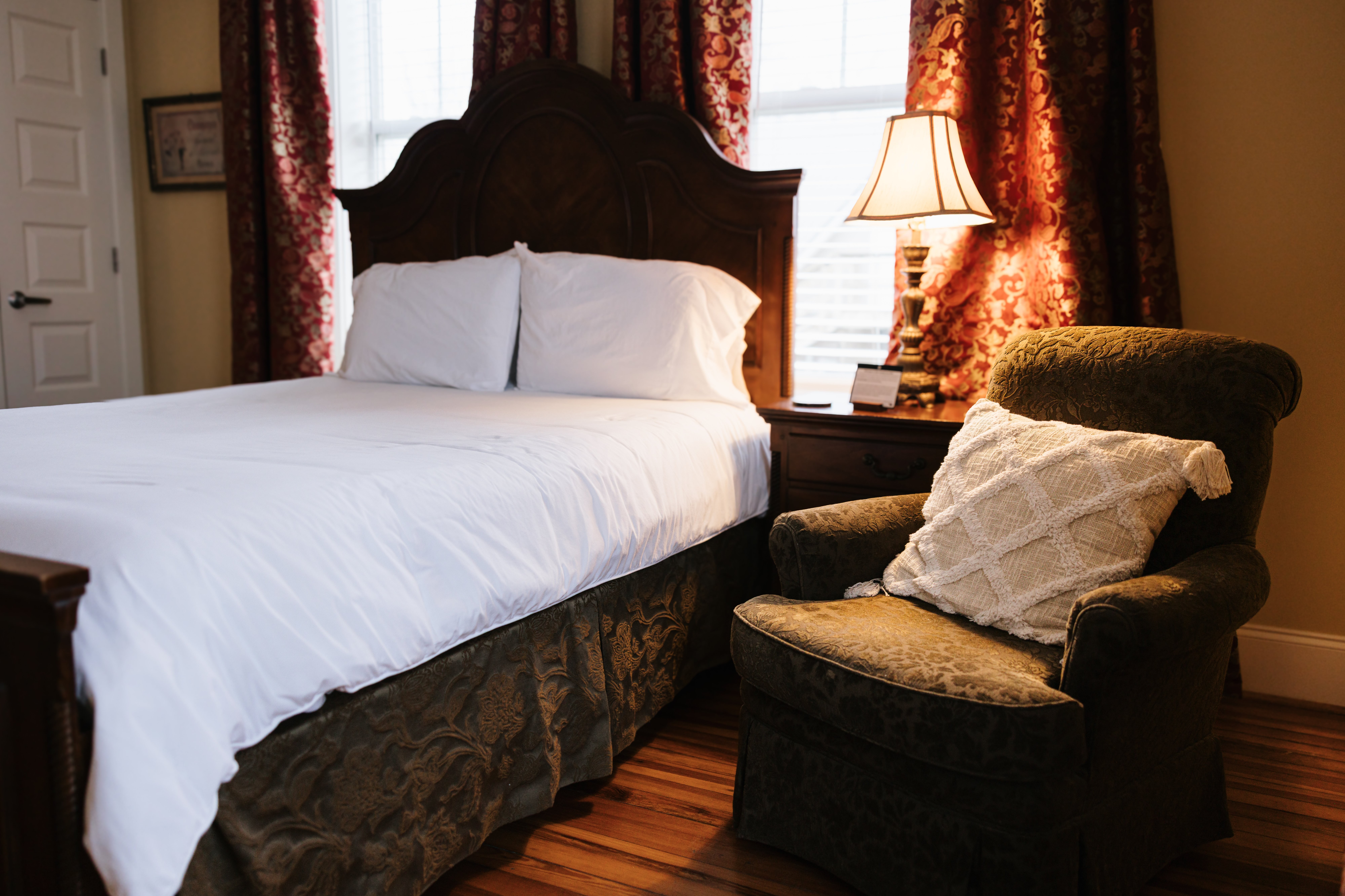 Cozy armchair with reading lamp in the corner of The Chezy Room