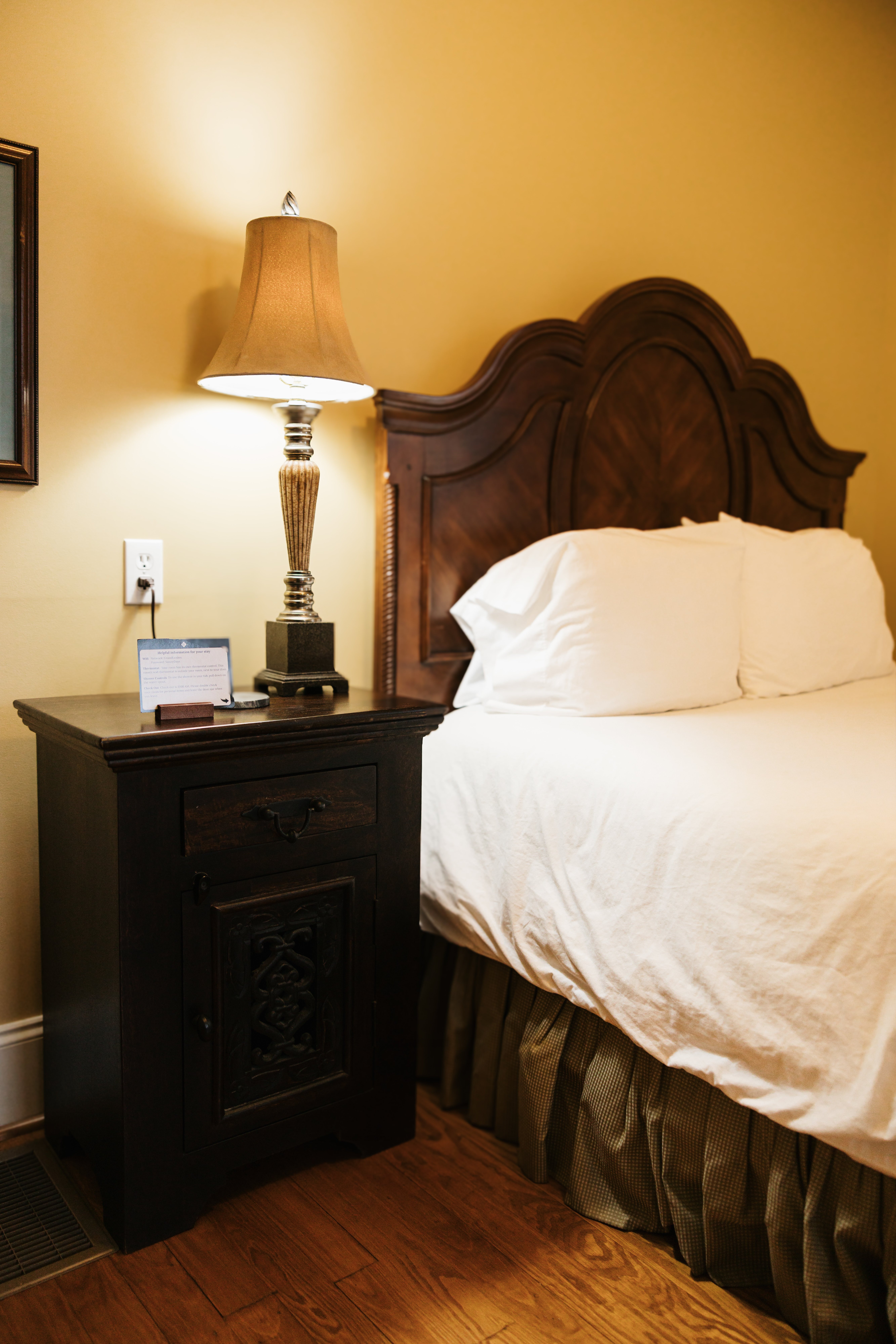 Nightstand and headboard detail in The Lyon Room