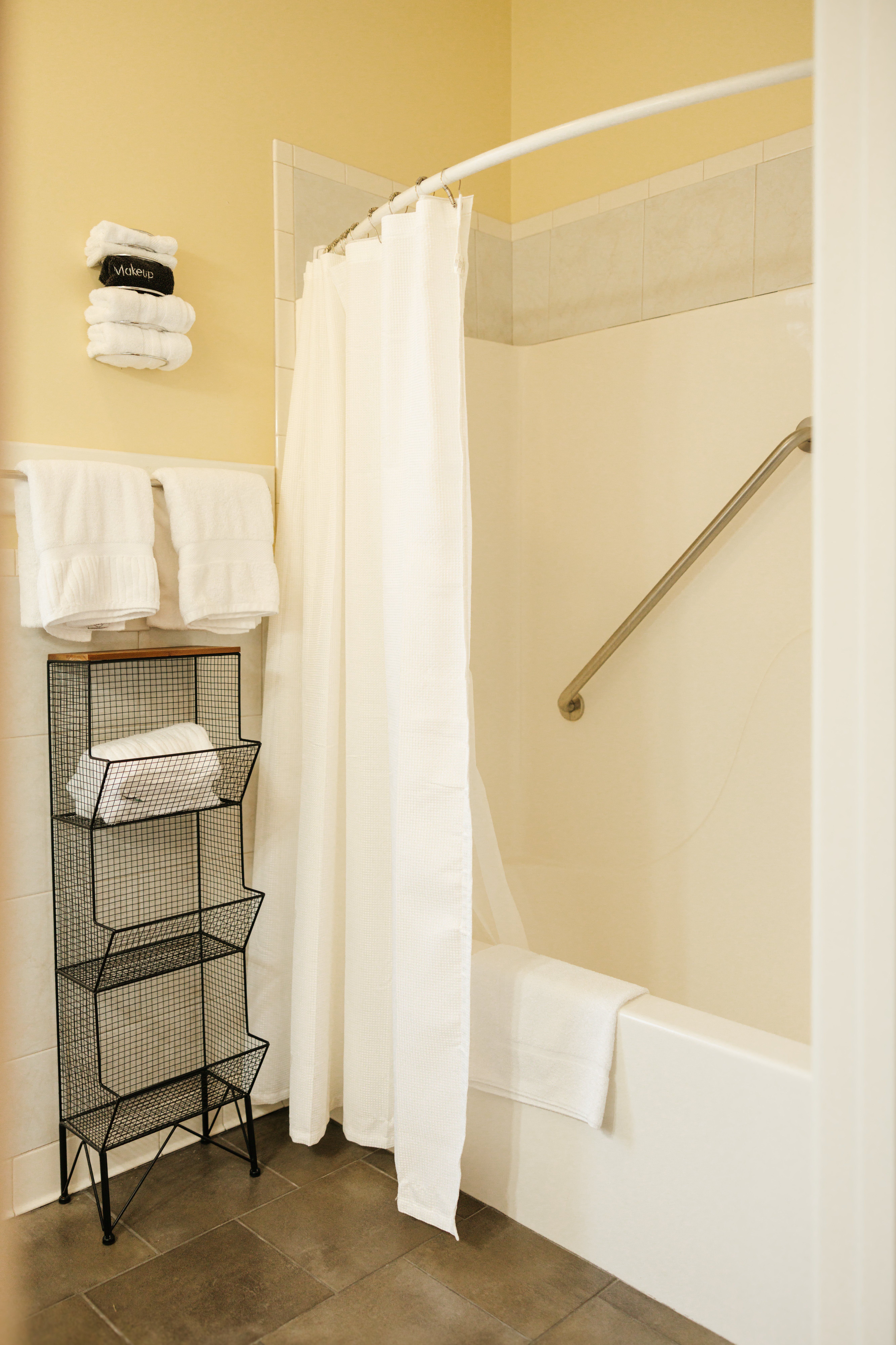 Accessible shower and tub with grab bar in The Lyon Room bathroom