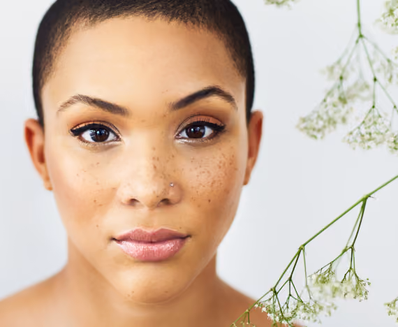 Beautiful woman with greenery around her face