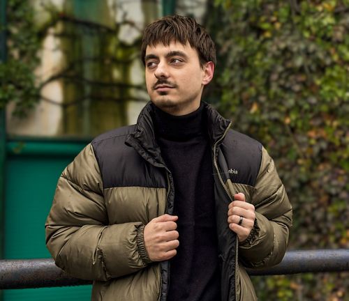 kid drinking from cup in front of pc