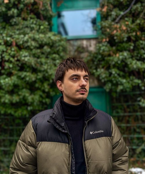 Boy in front of pc, staring far away