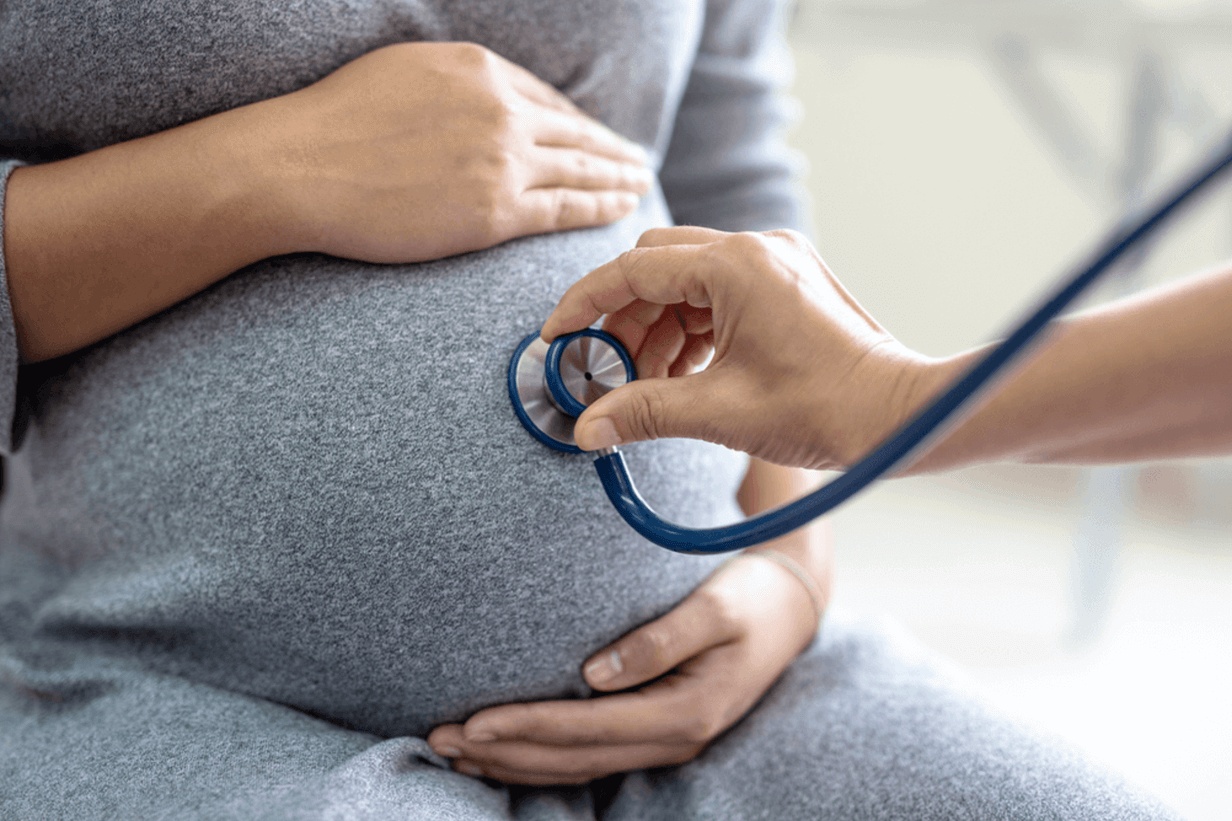 An OB/Gyn doctor checks a pregnant woman’s baby’s heartbeat at a low-cost prenatal appointment in Southern California. 