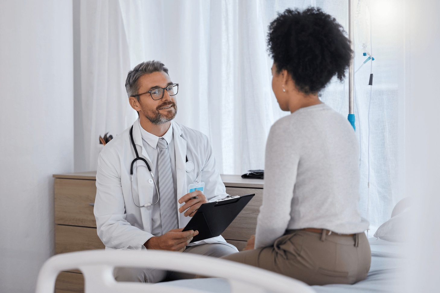 Doctor consulting with a patient in a bright medical office, representing personalized healthcare guidance from the best affordable doctor in Southern California.