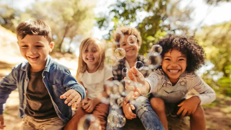 Healthy, happy children smiling and playing