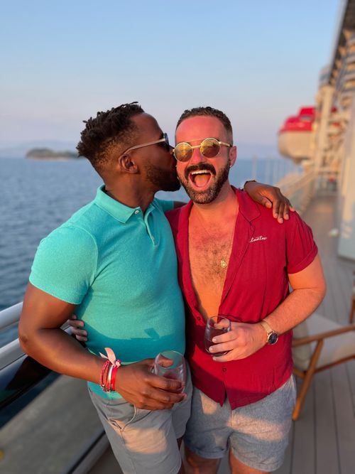 Filipino man in speedo on a rainbow-shaped pool float at Bimini Beach Club