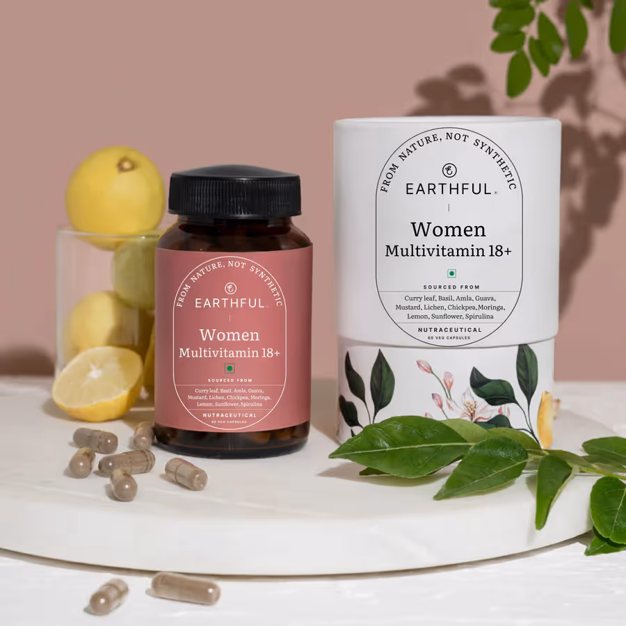 A bottle of Earthful Multivitamin Women 18+ capsules alongside its outer cover.