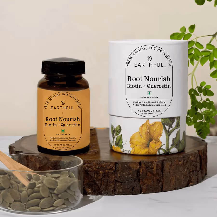 The bottle of Earthful Root Nourish Capsules alongside its outer cover.