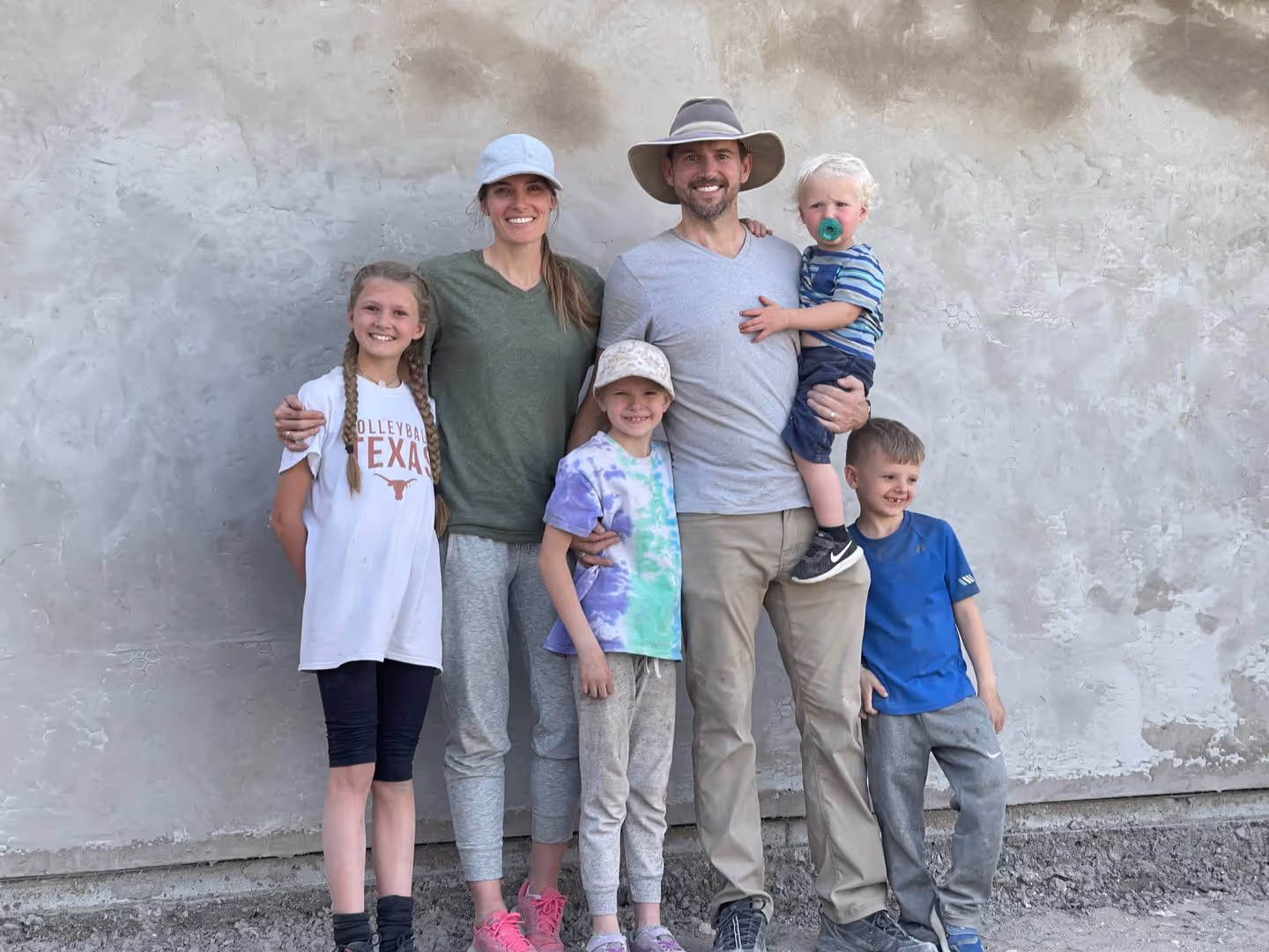 Travis McAshan with his family on a mission trip