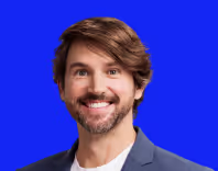 Profile photo of Travis McAshan on blue background