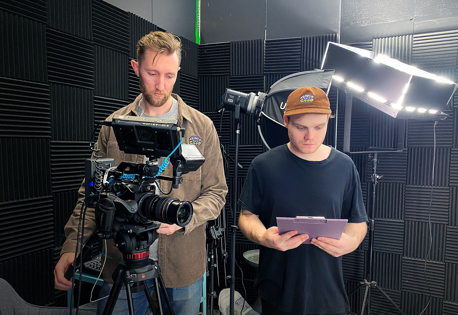 Photo of two men operating a camera in a film studio