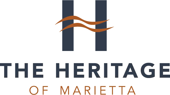 Logo for The Heritage of Marietta with two vertical bars and two wavy lines in the center.
