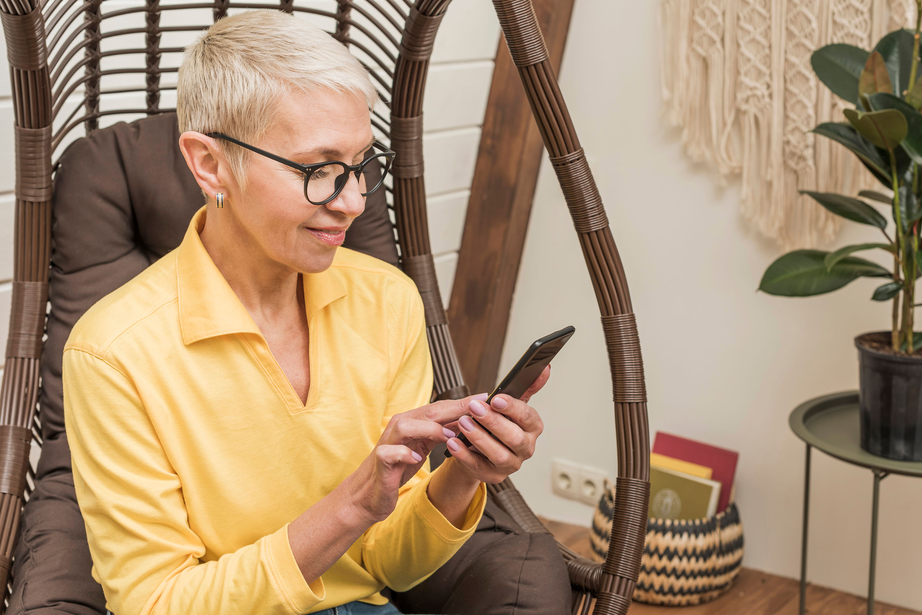 Woman in a yellow shirt using her smartphone, with "Marketing Requests" text overlay
