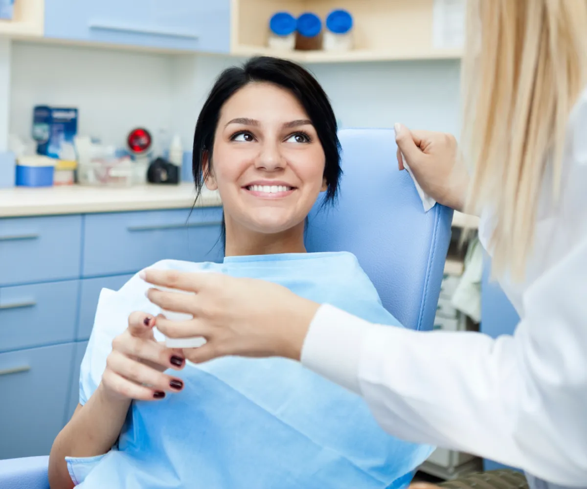 Patient receiving a glass or water