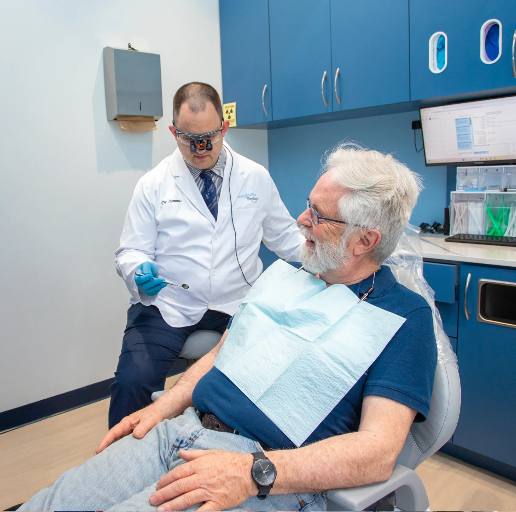Dr. Sommer checking patient