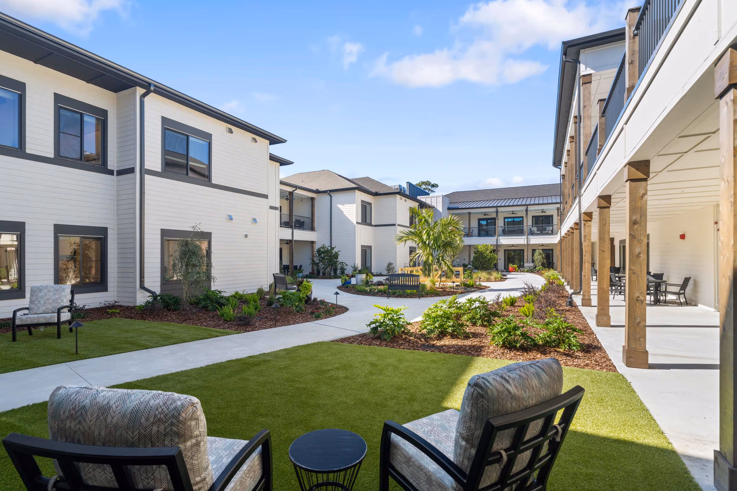 Beautiful outdoor courtyard with seating and landscaped walkways at Elevate in Clearwater, Florida.