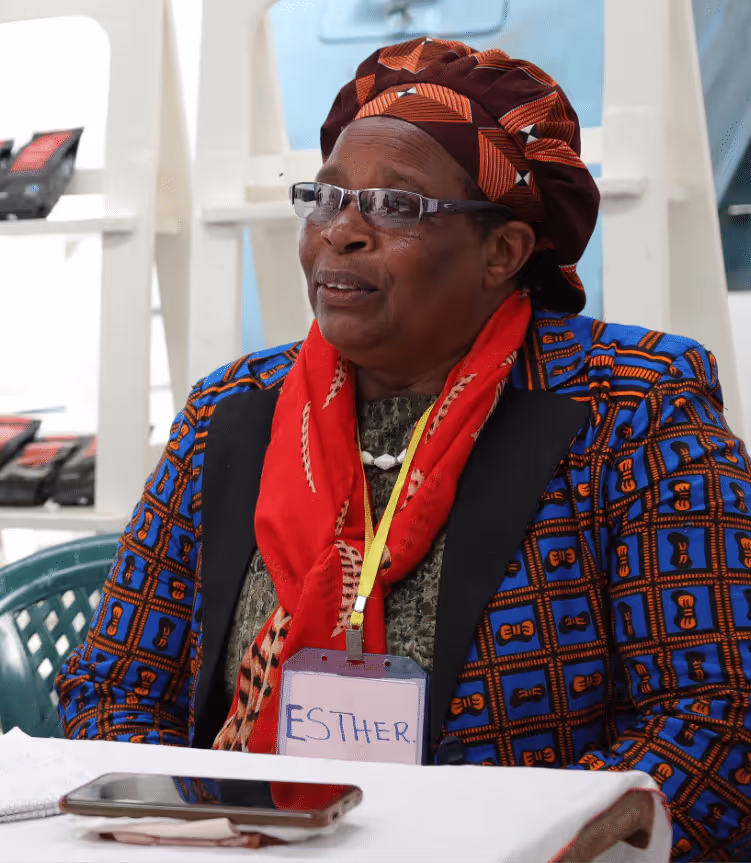 a woman with glasses sitting at a table