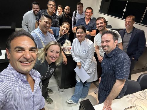 Doctors and instructors smiling together in a training room
