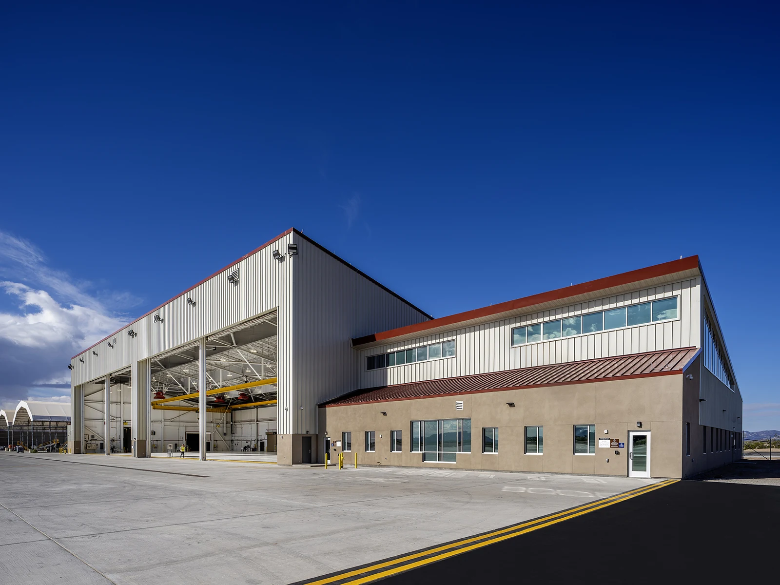 air craft hangar with a red roof