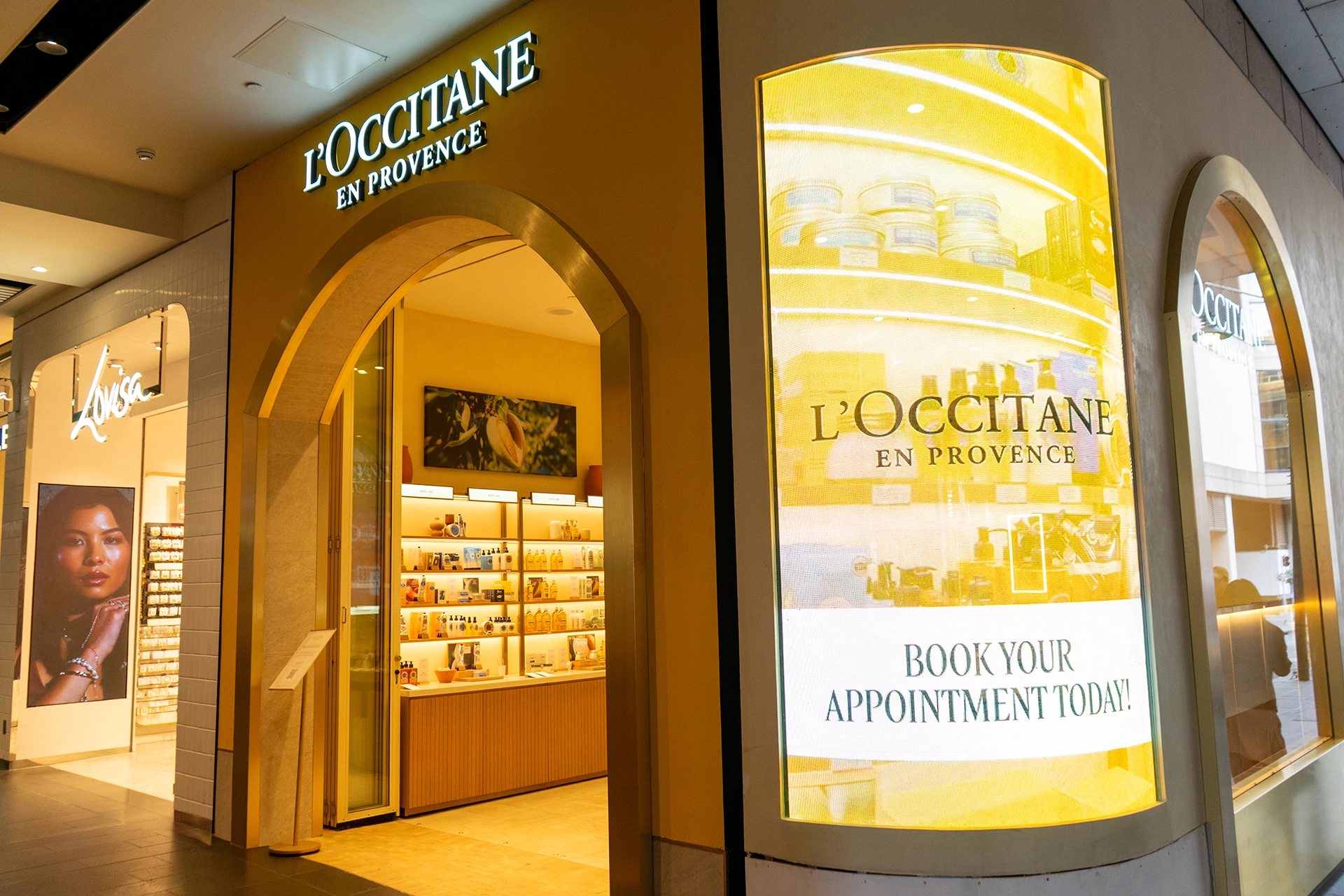 L'Occitane Elevates Storefront Experience with Transparent Curved installation gallery image 3 by onQ Digital Group