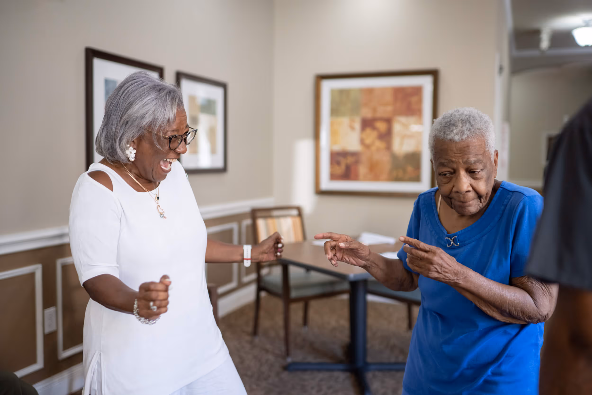 A couple of senior women dancing